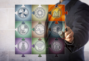 Blue chip plant manager touching chart icon in virtual planning matrix in form of a jigsaw puzzle. Industry concept for smart energy management, real time data, energy efficiency, energy monitoring.