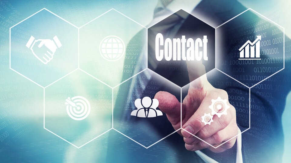 Businessman pressing a Contact concept button.