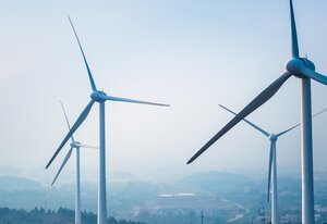wind farm closeup ,new energy with fog and haze weather 
