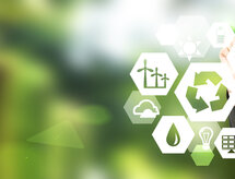 hand drawing signs of different green sources of energy in hexahedron shape, a 'reduce, reuse, recycle' sign in the centre. Blurred green background. Concept of clean environment.