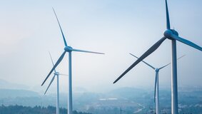 wind farm closeup ,new energy with fog and haze weather 
